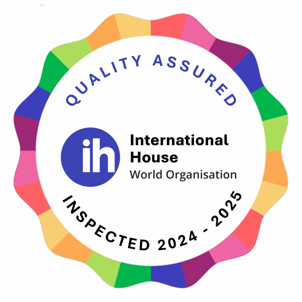 Circular badge with a colorful edge displaying "QUALITY ASSURED," the International House logo, and the text "INSPECTED 2024 - 2025.