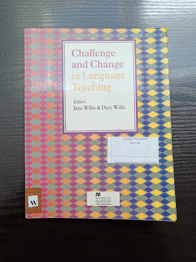 A book titled "Challenge and Change in Language Teaching," edited by Jane Willis and Dave Willis, lies on a dark surface. The cover features a colorful geometric pattern.