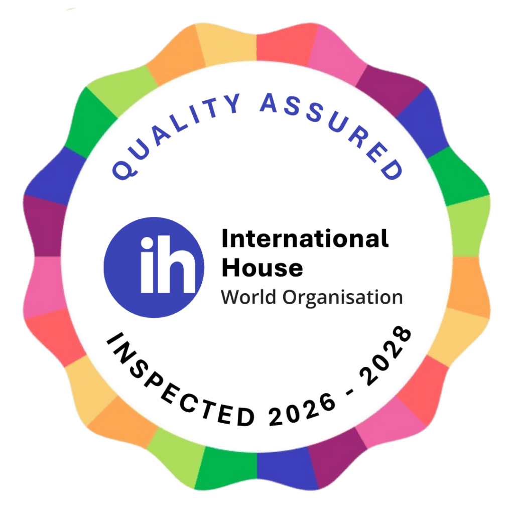 Circular badge with multicolor border, "Quality Assured" text, International House World Organisation logo, and "Inspected 2026–2028" written at the bottom.