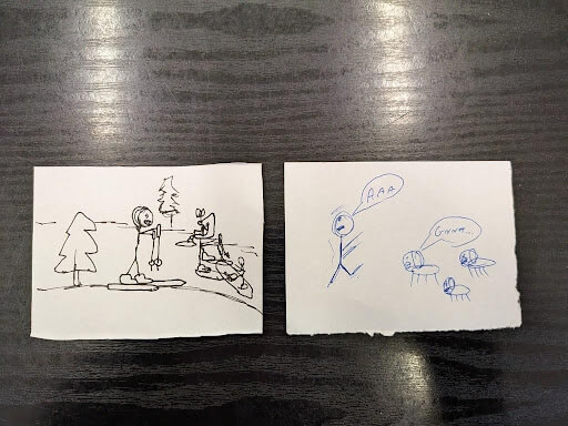 Two hand-drawn sketches on paper: one shows people skiing near trees, the other shows a person running from three animals with speech bubbles saying “AAA” and “Grrr.”.